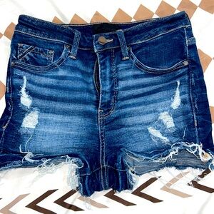 Buckle black jean short, stretchy with rips.